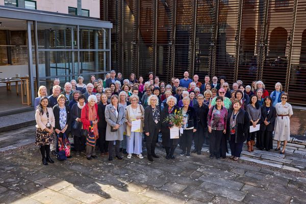 Volunteers and Staff in the courtyard at the Volunteer's Morning tea event, The Mint