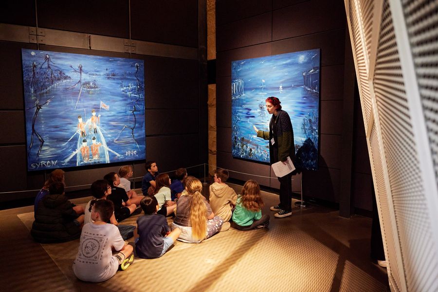 CPD (Bridget) talking to students about Gordon Syron painting, for Whose Place program at Museum of Sydney